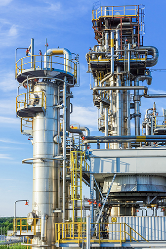 Two absorption columns stand at the gas processing plant
